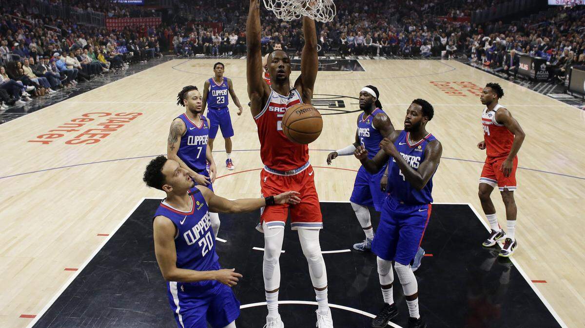 Sacramento Kings’ Harry Giles III, center, dunks against the Los Angeles Clippers during the first half of an NBA basketball game Saturday, Feb. 22, 2020, in Los Angeles. (AP Photo/Marcio Jose Sanchez)