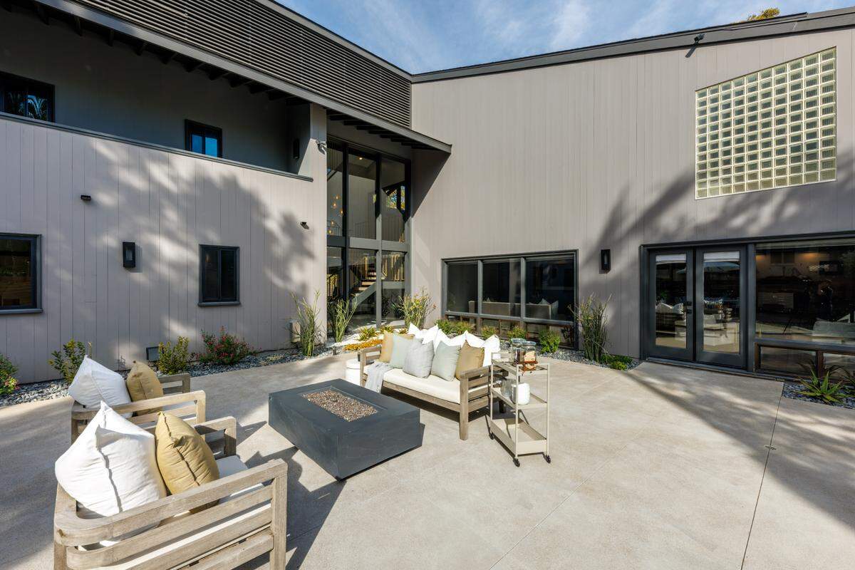 Among the San Diego listing’s other features are an open floor plan, chef’s kitchen and cozy backyard.