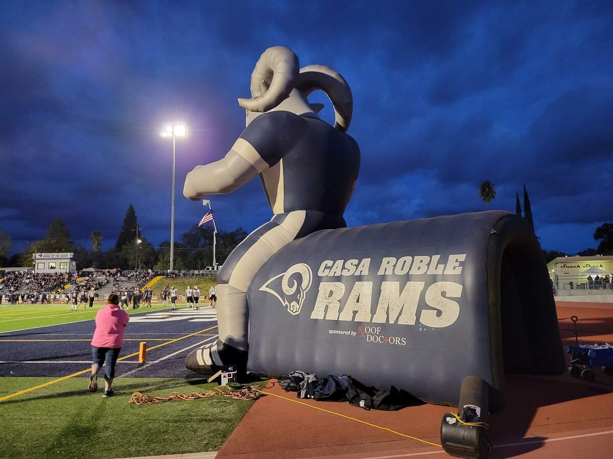 A giant inflatable sits just outside the end zone at Casa Roble High School in Orangevale.