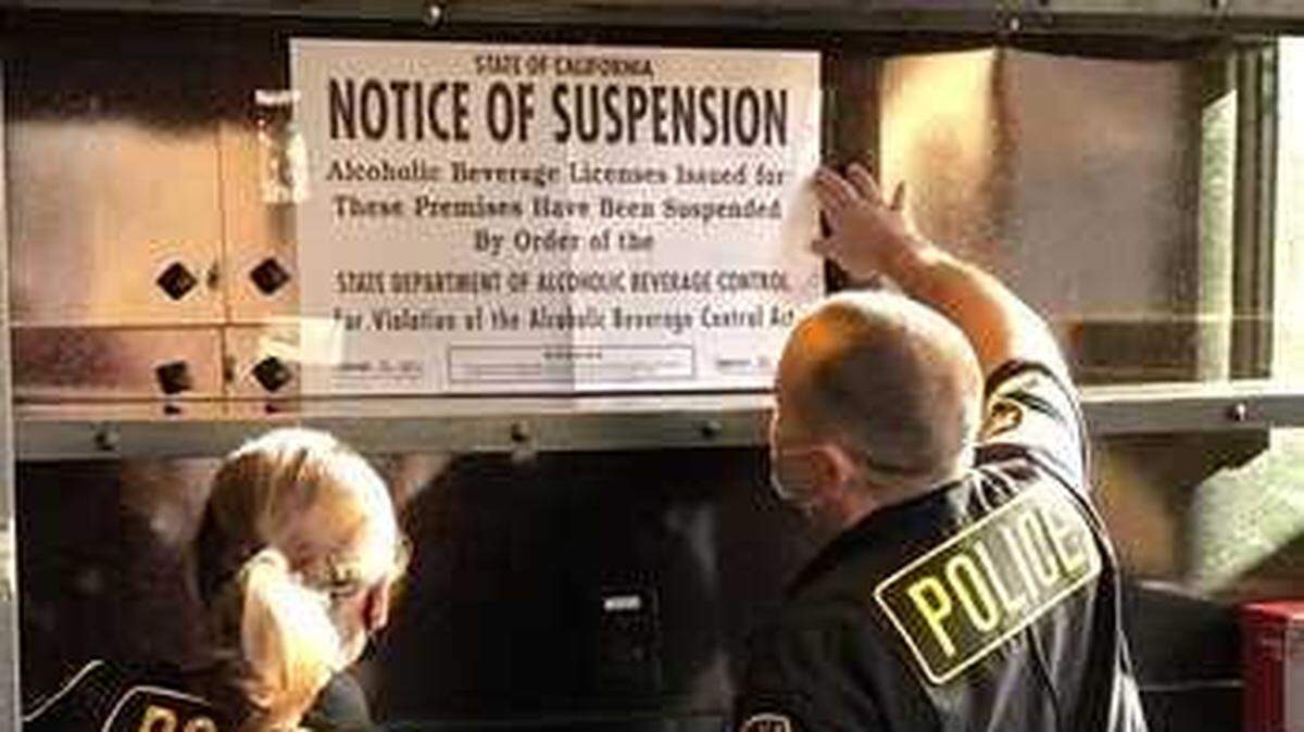 Agents from the California Department of Alcoholic Beverage Control on Friday Jan. 15, 2021, posted a notice of suspension sign at Catch a Wave by Blue Nami restaurant in Folsom, California. The restaurant’s alcohol license was suspended for 45 days as a result of an investigation that led to the arrests of two employees accused of serving alcohol to an underage worker the night she died in a crash.