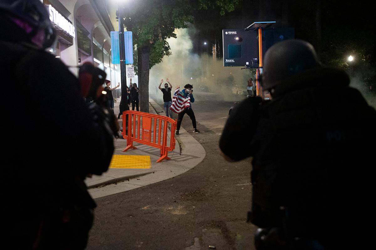 Sacramento Police fire tear gas to disperse demonstrators 10th Streets during a protest over the death of George Floyd on Sunday, May 31, 2020 in Sacramento during the coronavirus pandemic. George Floyd died in Minneapolis Monday after being detained by police.