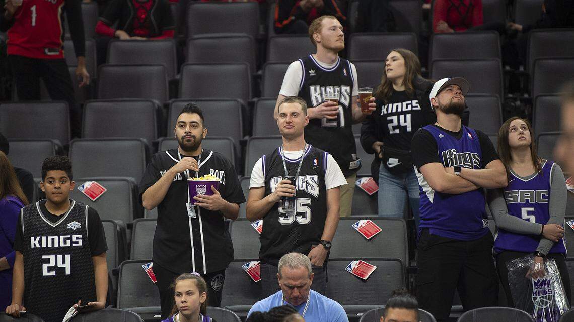 Sacramento Kings fans watch the team warm up before a game at the Golden 1 Center on Wednesday, March 11, 2020 in Sacramento. The game was the last one before the league postponed its season because of coronavirus concerns.