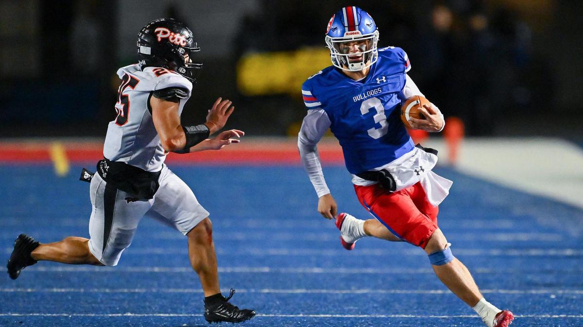 Folsom Bulldogs quarterback Ryder Lyons (3) runs the ball for a first down before being pushed out of bounds by the Pittsburg Pirates’ Elijah Bow (25) in the 2023 CIF Northern California Division 1-A championship game.