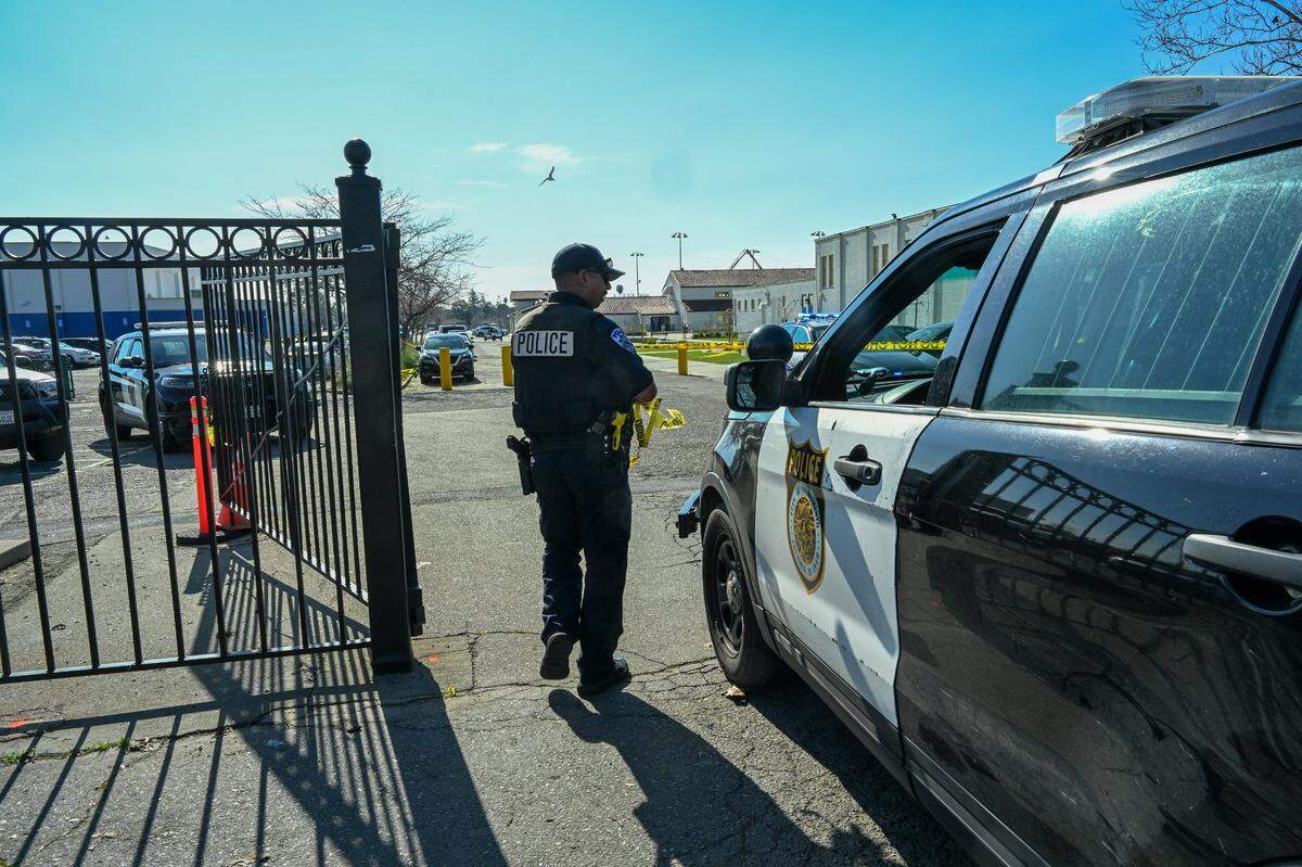 Sacramento Police arrive on the scene where a student was shot in the arm at Grant Union High School on Tuesday.