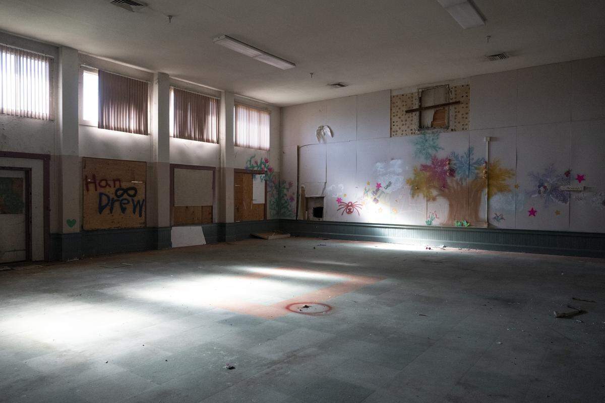 Graffiti marks the walls of the theater inside the Old North Sacramento School earlier this month. 