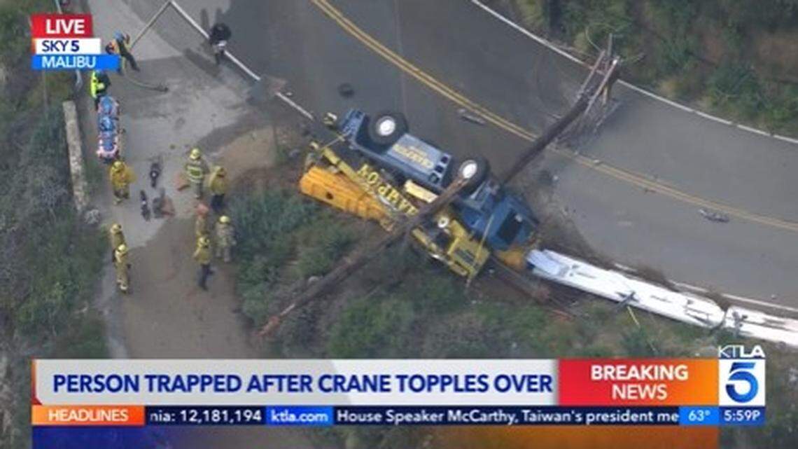 A driver died after a Malibu crash toppled his crane and entangled it in power lines, California firefighters say.