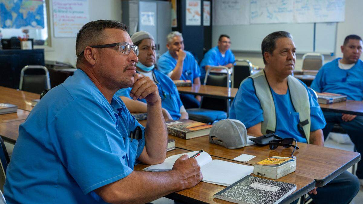 Enrique Sandoval, Daniel Arciniega and Eleazar Alicantar learn English language skills in class at San Quentin State Prison on Wednesday. In March 2023, Gov. Newsom announced a plan to transform the prison into the San Quentin Rehabilitation Center.
