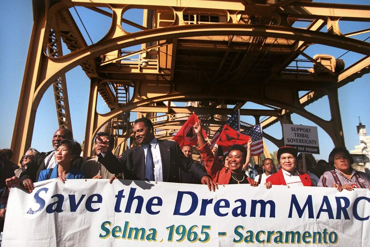 The Rev. Jesse Jackson, leads his Save the Dream march across the Tower Bridge on its way to the state Capitol on Oct. 27, 1997.