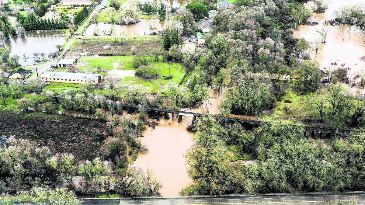 An aerial view of the Cosumnes River in Wilton shows flooding to nearby homes and farms on Jan. 5, 2023. Sacramento County officials have secured a grant to study improved evacuation routes for Rancho Murieta, a gated community on the eastern fringe of the county.