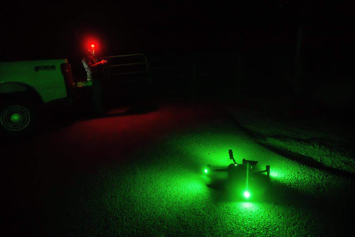 Researcher Lori McCurdy operates a drone equipped with thermal imaging and speakers to monitor cattle and deter wolf attacks in Sierra Valley on Friday, Sept. 12, 2025. The drone’s battery must be replaced every 20 minutes, and McCurdy operates it throughout the night. She and a U.S. Department of Agriculture team successfully prevented any wolf attacks on livestock, which have been increasing lately, during the night.