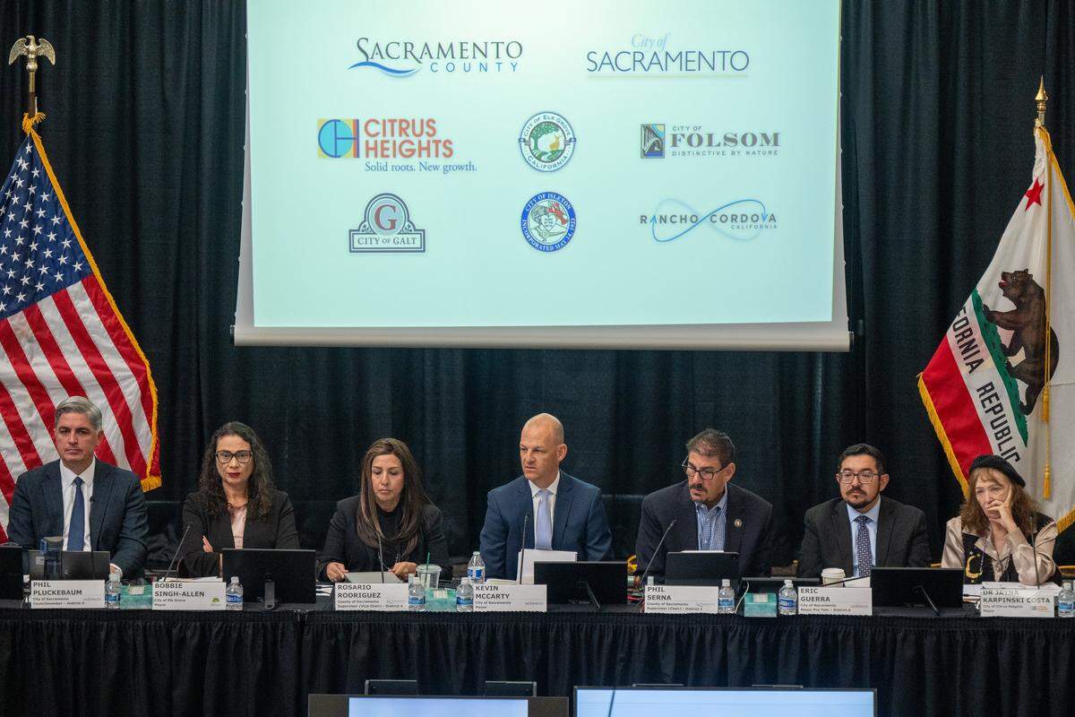 Sacramento Mayor Kevin McCarty, center, attends a county-city meeting with other local elected officials on homeless services and behavioral health at the Tsakopoulos Library Galleria in Sacramento on Tuesday.
