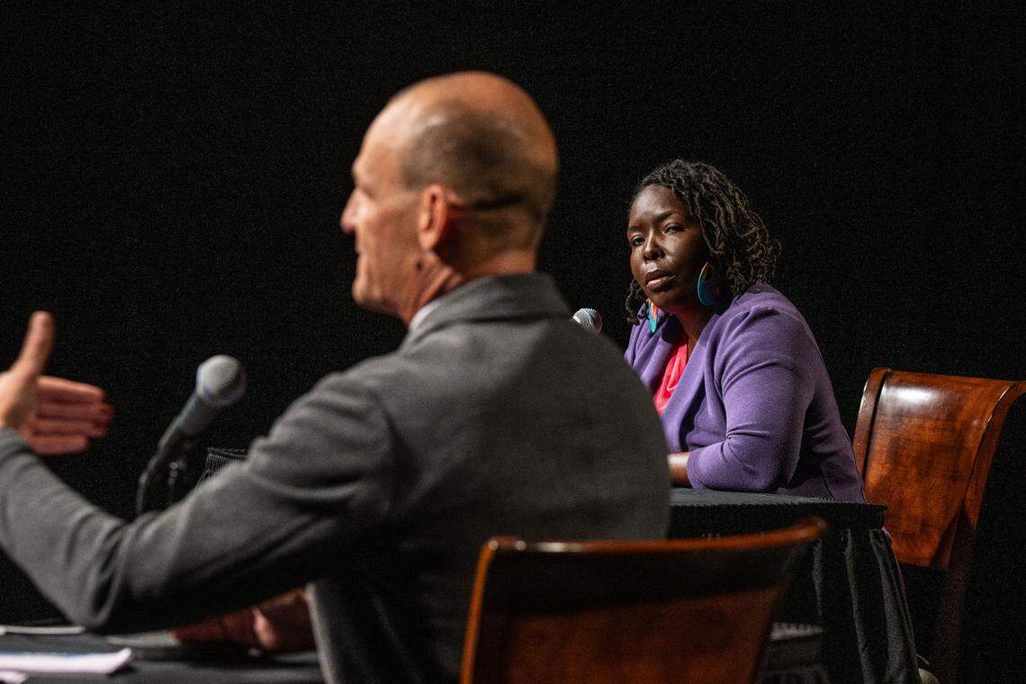 Sacramento mayor candidate Flojaune Cofer, right, listens as his opponent Kevin McCarty responds to a question during a mayoral debate sponsored by The Sacramento Bee and KVIE on Wednesday, Oct. 23, 2024.