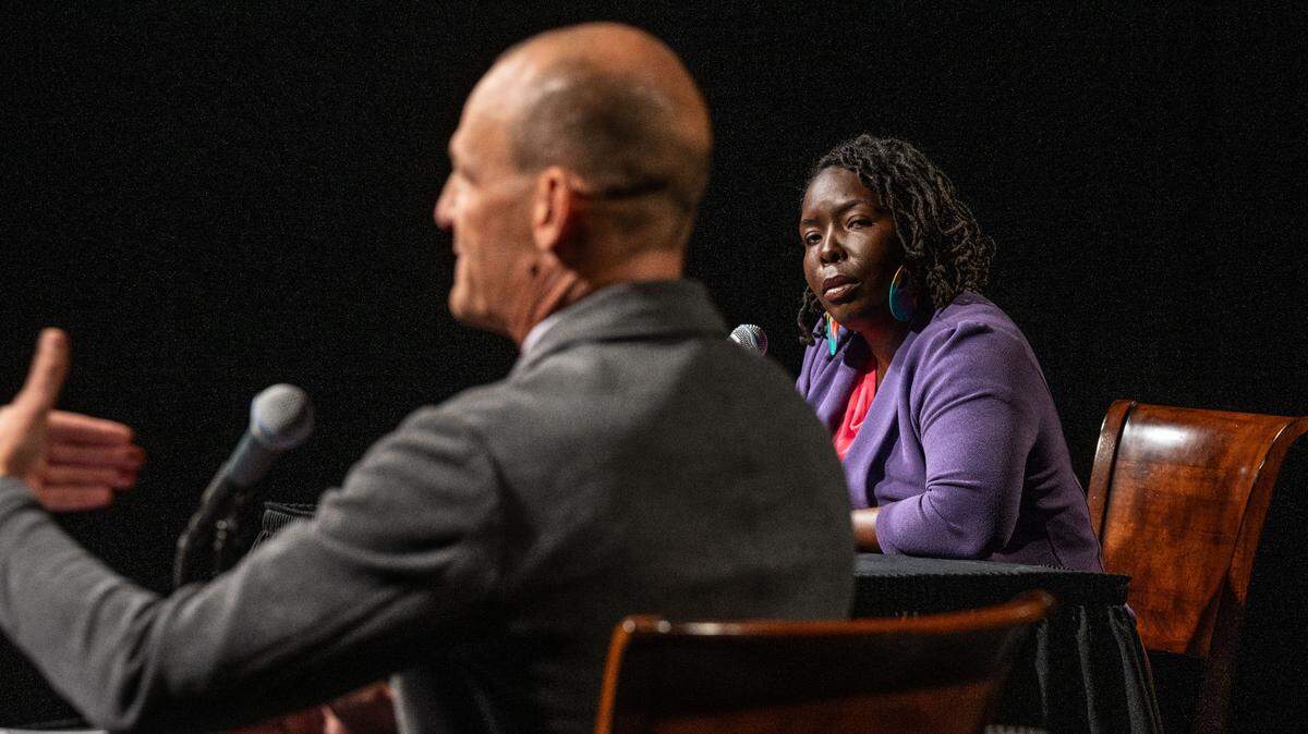 Sacramento mayor candidate Flojaune Cofer, right, listens as his opponent Kevin McCarty responds to a question during a mayoral debate sponsored by The Sacramento Bee and KVIE on Wednesday, Oct. 23, 2024.