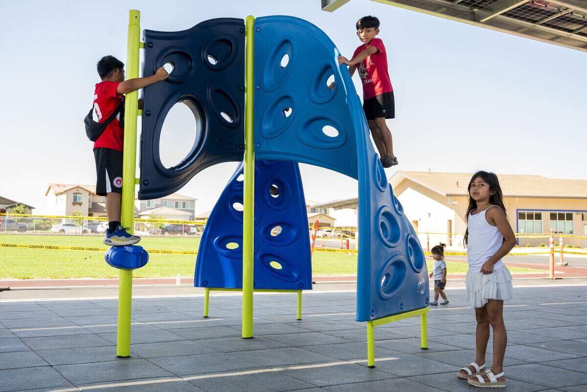 Students play on the playground at Cypress Grove Elementary School during the school’s grand opening in Rancho Cordova on Tuesday.