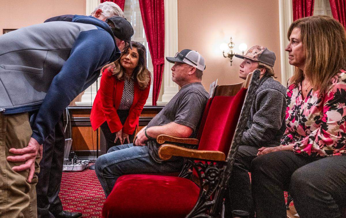 The family of Taylen Brooks, who was killed last year in a mountain lion attack, listens to state Sen. Marie Alvarado-Gil, R-Jackson, as she asks for their input on proposed amendments during a Tuesday committee hearing on Senate Bill 818. Alvarado-Gil rejected the proposed changes to the bill, which would have allowed trained dogs and their handlers to chase away mountain lions.