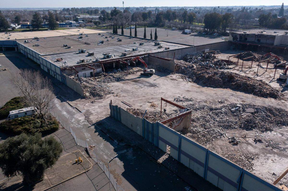 The Feather River Center in Linda is demolished Thursday. The center, formerly known as Peach Tree Mall, flooded during a 1986 levee break on the Yuba River and never reopened.