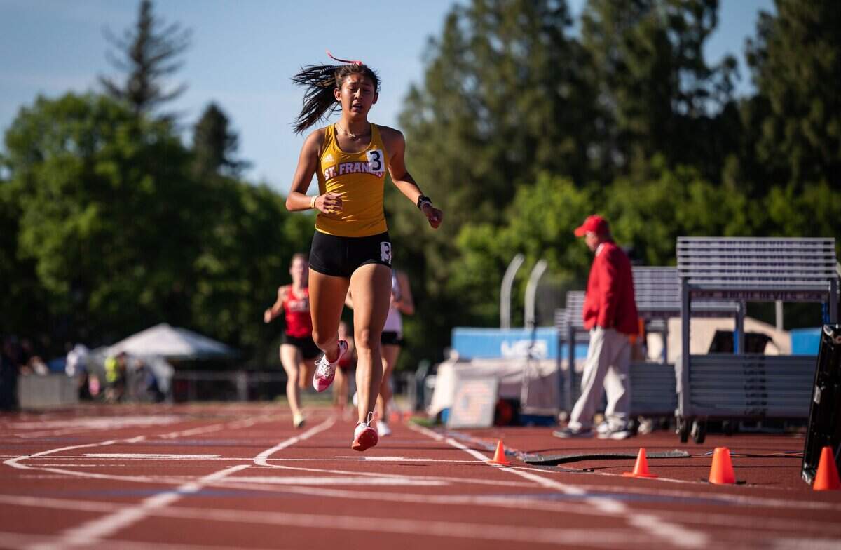 St. Francis’ Tatiana Cornejo finishes the girls’ 1,600-meter run in first place at the CIF Sac-Joaquin Section Masters track and field finals at Davis High School on Saturday.