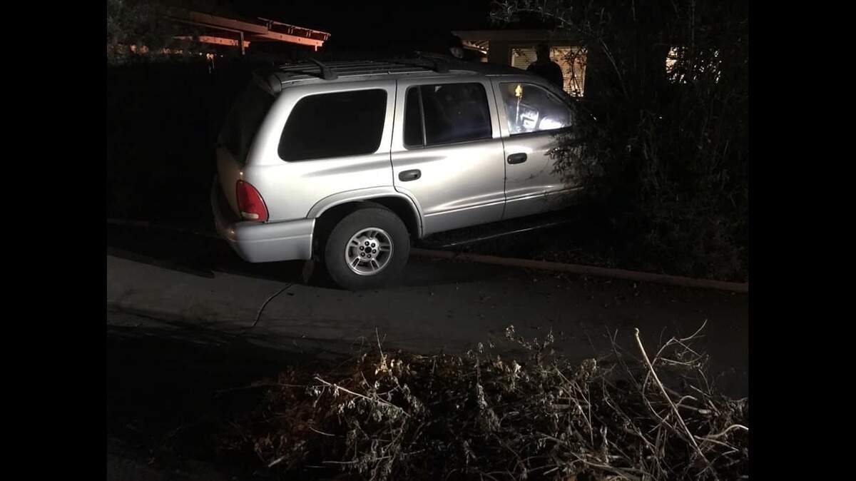 A stolen Dodge Durango was abandoned after crashing through a wooden and metal fence and ending up in someone’s front yard, according to the Woodland Police Department. The robbers left two BB guns on the front seat before fleeing.