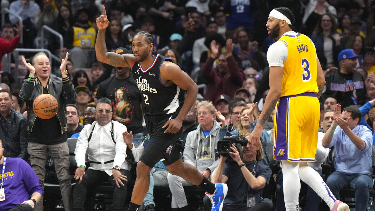 Los Angeles Clippers forward Kawhi Leonard (2) celebrates as Los Angeles Lakers forward Anthony Davis (3) reacts in the second half at Crypto.com Arena on April 5, 2023.