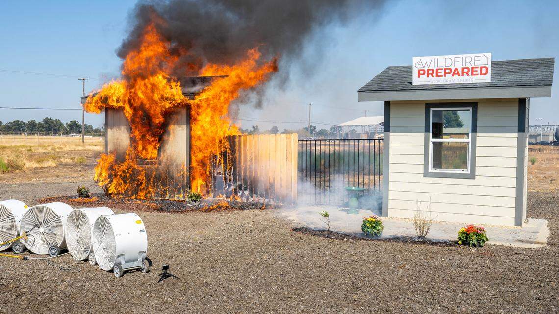 Cal Fire shows the difference between an unmitigated home, left, and a mitigated home, right, and how they stand up to wildfires in a live demonstration at the Sacramento Fire Department Training Brickyard on Tuesday, Sept. 19, 2023. A California bill attempted to guarantee home insurance coverage for people in communities that reduce their risk of wildfires. 