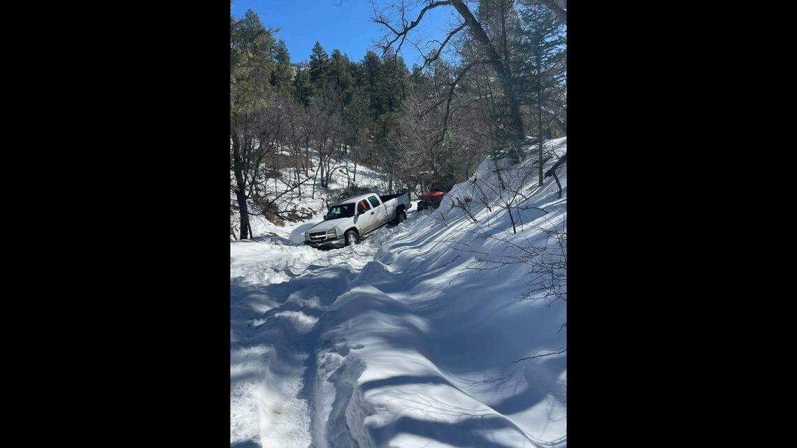 A missing couple and their dog were found safe after their truck got stuck in the snow while they were driving home, Arizona authorities said.