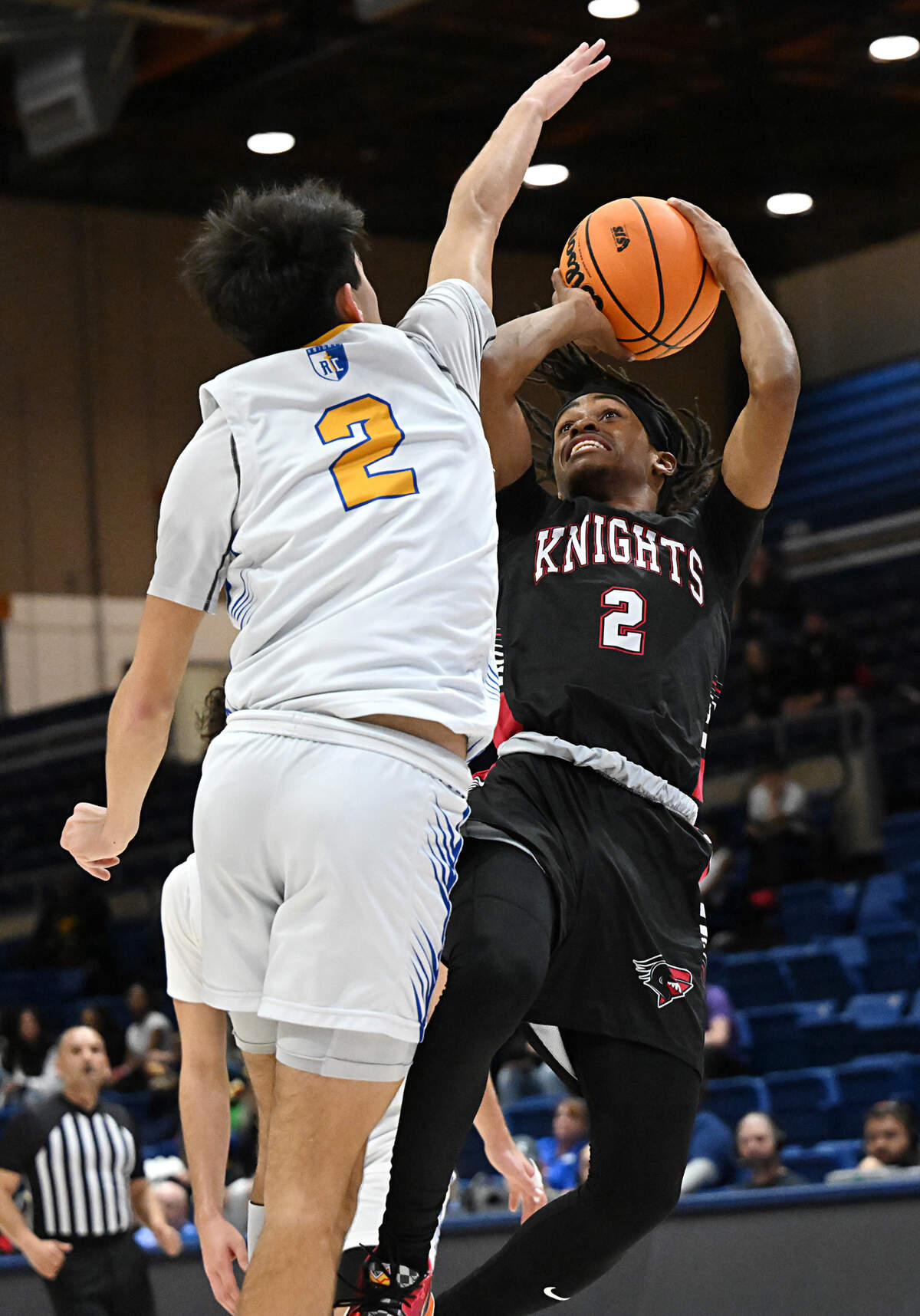 Futures’ Keylen Garth shoots under pressure from Ripon Christian’s Luke Crivello during the Sac-Joaquin Section Division V title game at UC Davis on Friday.