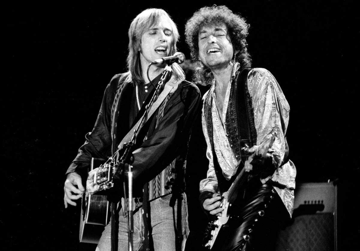 Tom Petty, left, and Bob Dylan sing harmony at the Mid-State Fair in Paso Robles in 1986.