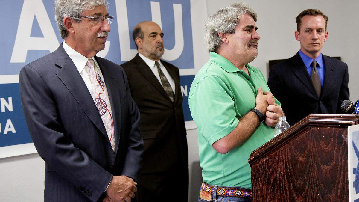 Lead plaintiff James Flavy Coy Brown, second from right, talks during a news conference at ACLU headquarters in Las Vegas in 2013 about a class-action lawsuit against the state of Nevada for busing psychiatric patients out of state.  A civil jury decided Nov. 1  in favor of Brown.