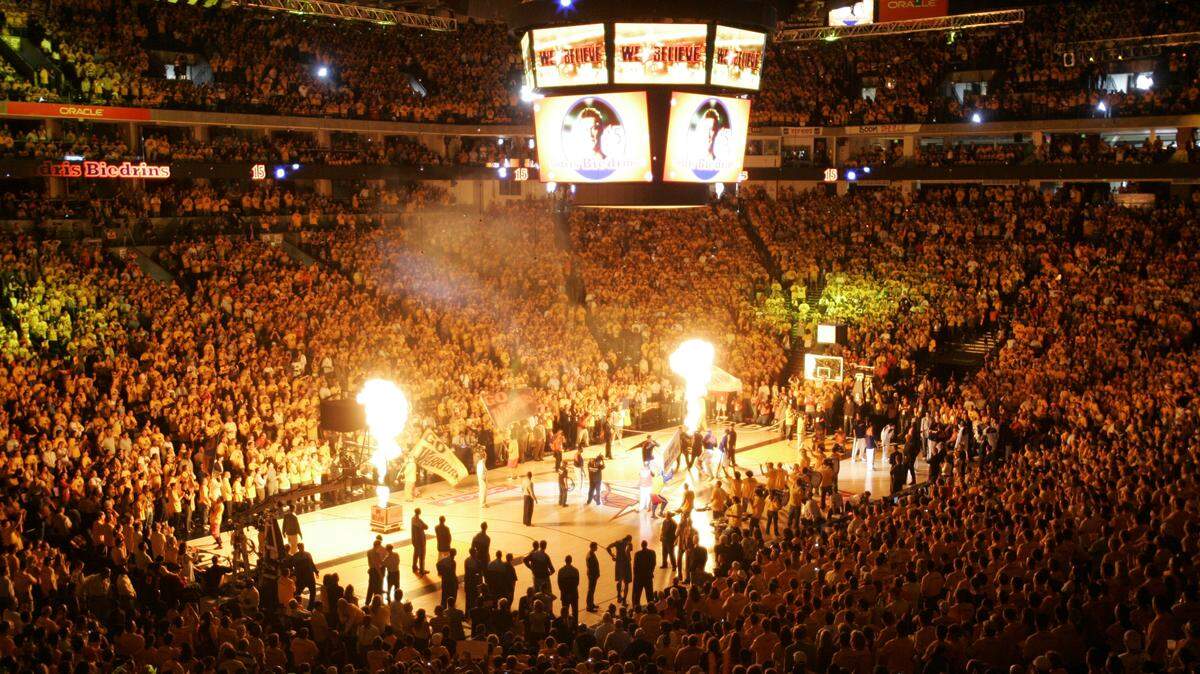 Flames light up as the Golden State Warriors are introduced before the start of an NBA Western Conference second-round playoff game against the Utah Jazz on May 13, 2007, in Oakland.