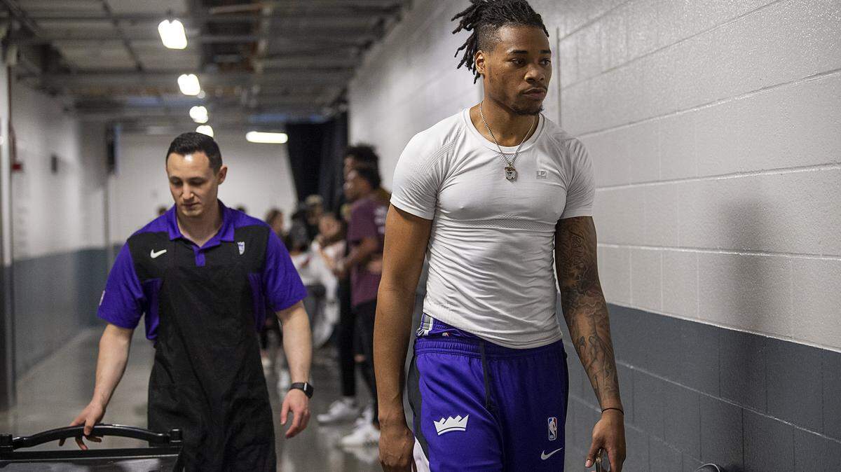Sacramento Kings center Richaun Holmes (22) walks to the locker room at Golden 1 Center on Wednesday, March 11, 2020, after the team’s game with the New Orleans Pelicans was postponed.