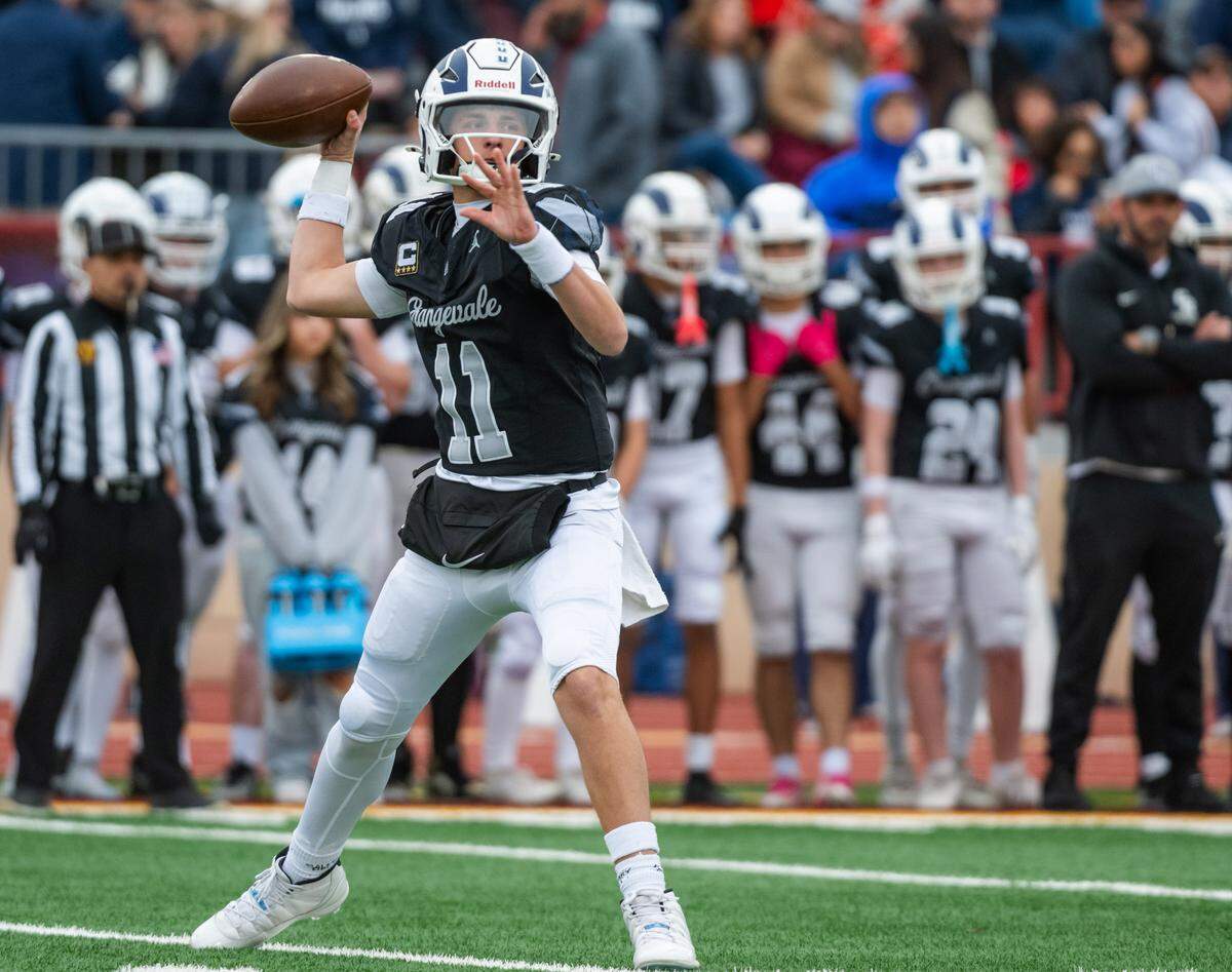 Casa Roble Rams quarterback Aidan Lopez (11) looks downfield against the Sutter Huskies in the CIF Sac-Joaquin Section Division V championship at Hughes Stadium in Sacramento on Friday.