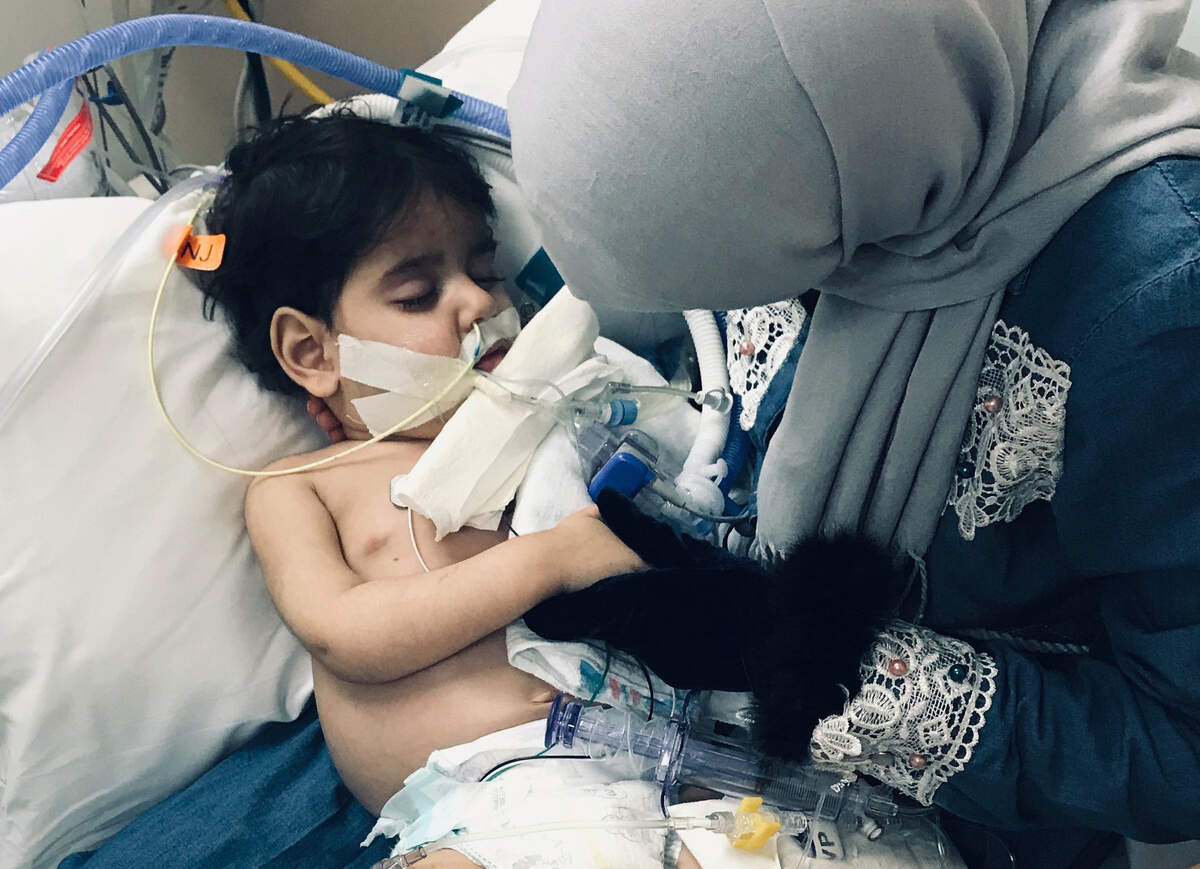 In this December 2018 photo released by the Council on American Islamic Relations, Sacramento Valley, Shaima Swileh of Yemen holds her dying 2-year old son Abdullah Hassan at UCSF Benioff Children’s Hospital in Oakland.