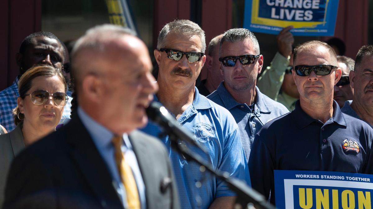 Union supporters watch Sacramento Mayor Darrell Steinberg speak at a press conference at Sacramento Fire station No. 5-731 on Broadway in Sacramento on Wednesday, June 27, 2018, in reaction to the fair share fees decision by the Supreme Court.