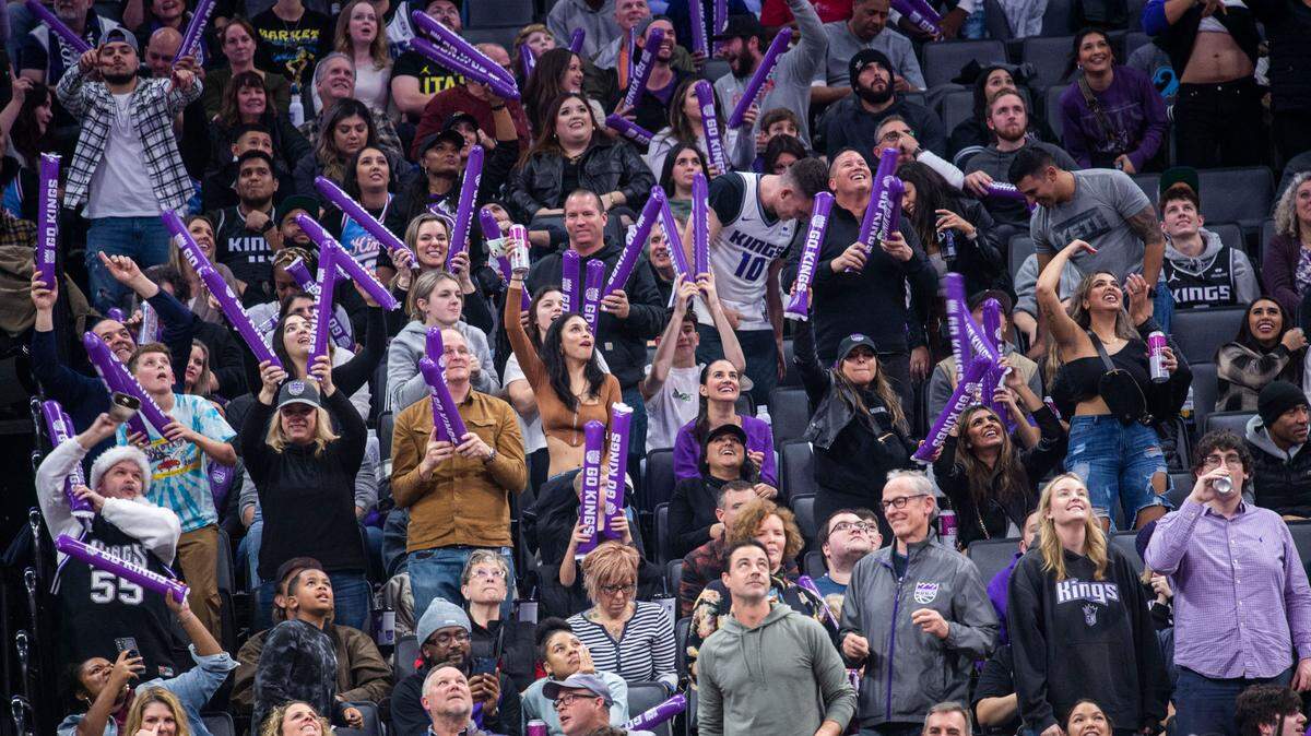 Sacramento Kings fans cheer on their team against the Utah Jazz on Friday, Dec. 30, 2022 during an NBA basketball game at Golden 1 Center in Sacramento.