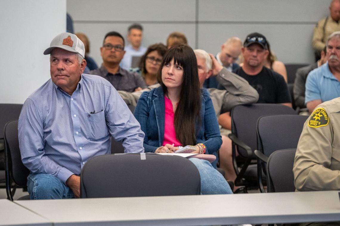 Rick Roberti, a rancher and president of California Cattlemen’s Association, and his daughter Katie Roberti, who serves as the association’s communications director, listen during a meeting of the Wildlife Resources Committee of the California Fish and Game Commission on Thursday.