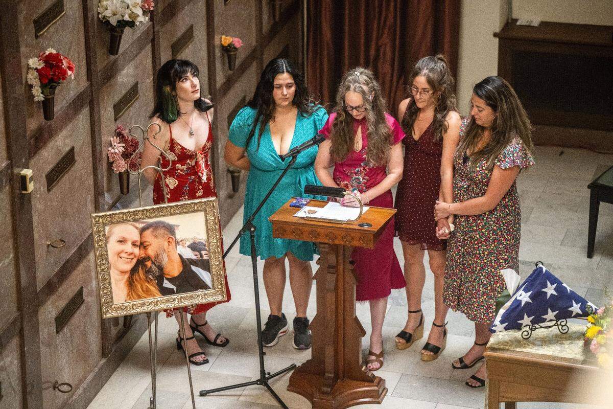 Michelle Silva, center, surrounded by daughters Lunden Almquist, Madeline Silva, Sahara Almquist and Kyra Geithman, remembers her husband José Luis Silva during his funeral at East Lawn Cemetery in Sacramento.