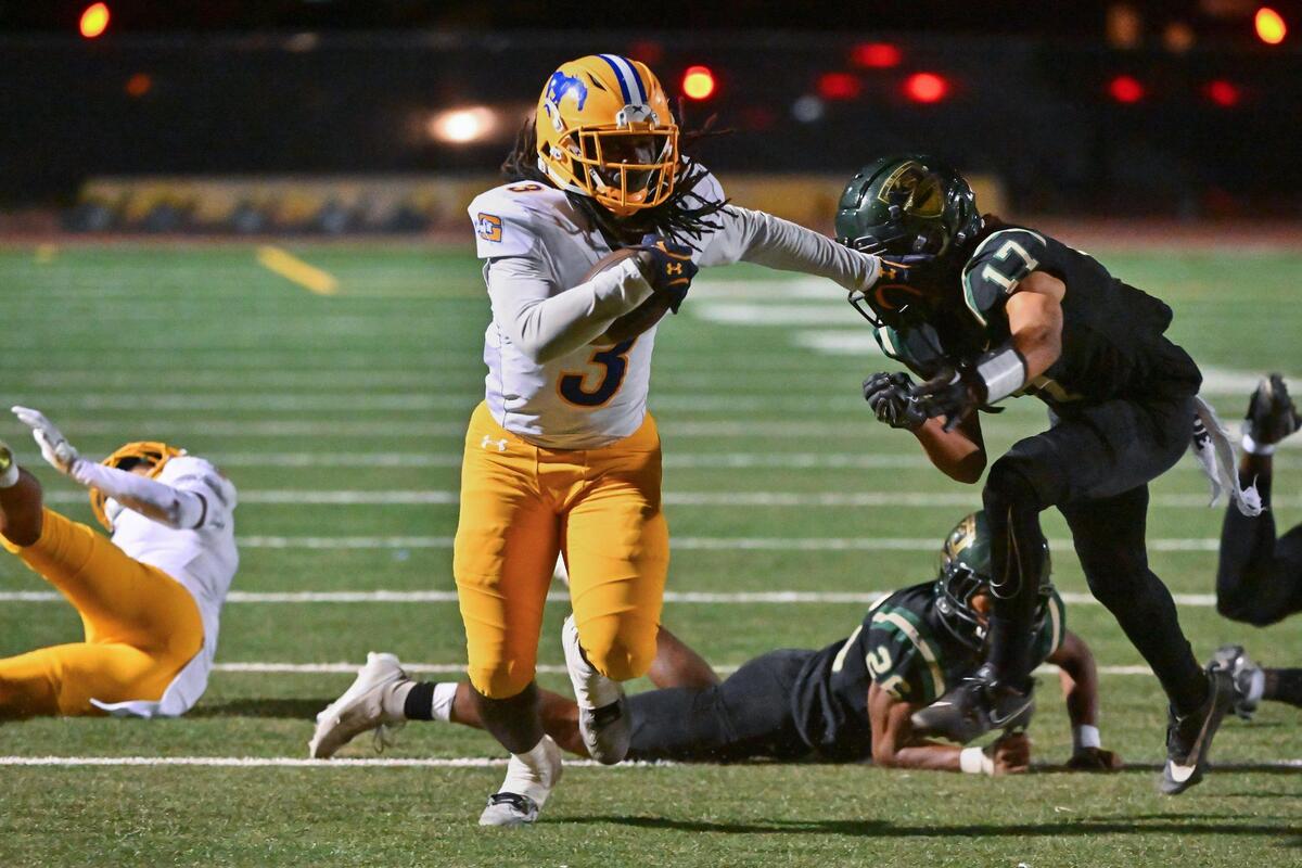 The Grant Pacers Devin Green (3) runs the ball for six yards before stepping out-of-bounds during the game on Friday, Oct. 20, 2023, at Monterey Trail High School in Elk Grove.