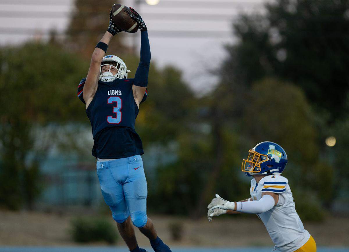 The Destiny Christian Lions’ Greyson Smith (3) pulls down an interception against the Linden Lions in September. His team will play at Christian Brothers on Friday.