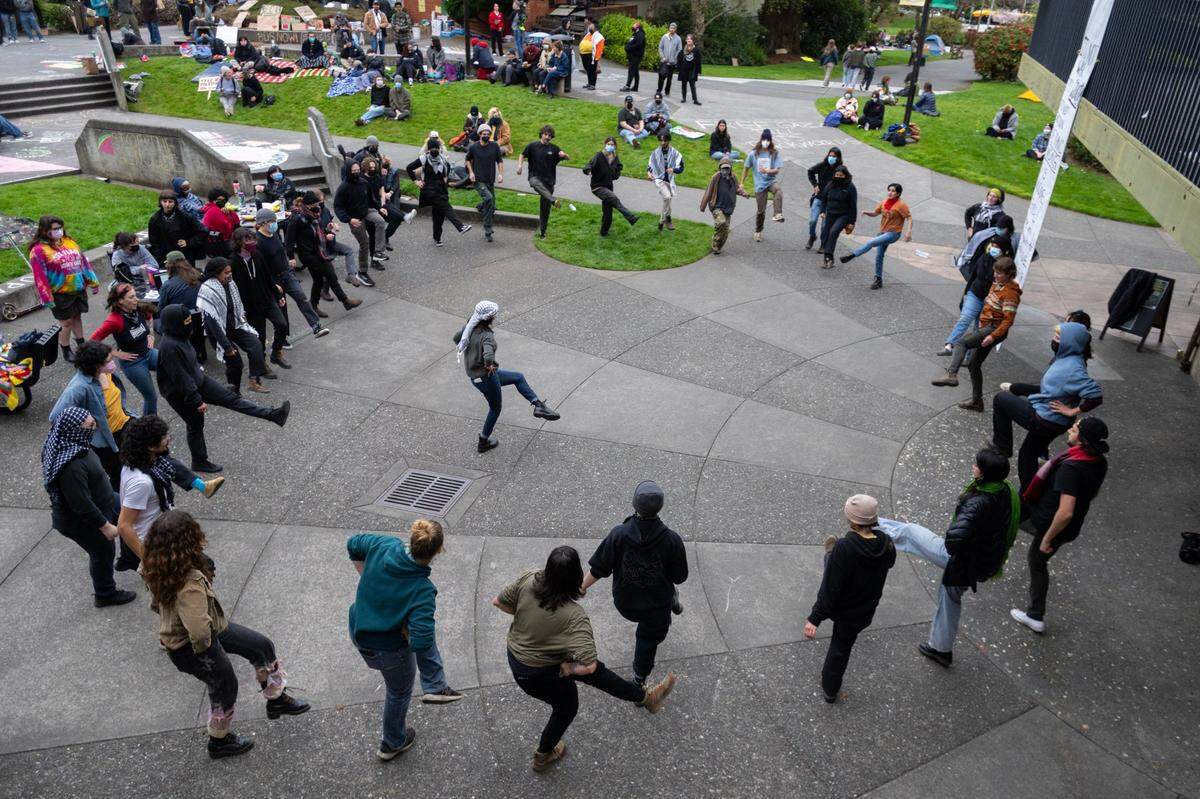 Students and community members perform a traditional Palestinian dance called dabke in support of pro-Palestinian protesters barricaded inside Siemens Hall at Cal Poly Humboldt in Arcata in 2024.