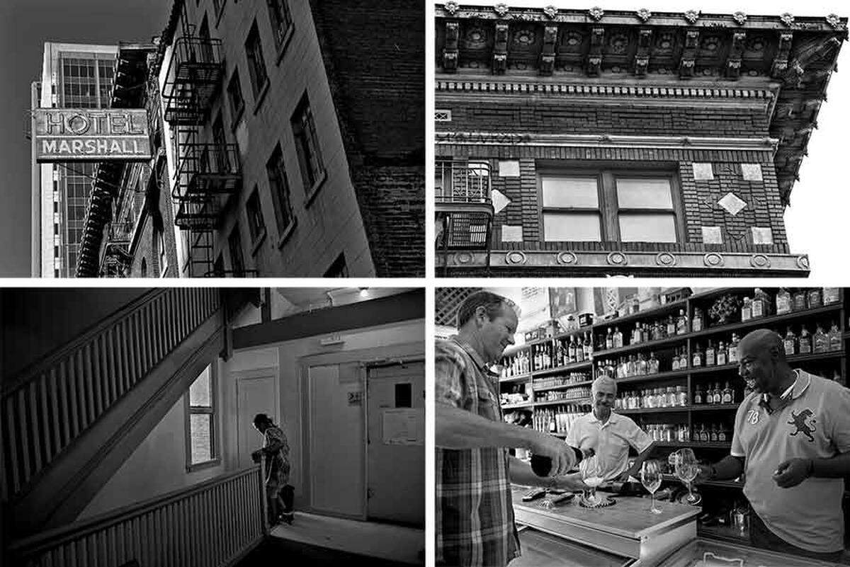 At top, the historic Hotel Marshall is juxtaposed against newer high-rise buildings. The hotel’s original facade will remain intact, but the inside will be gutted and rebuilt into an upscale hotel. Bottom left: Skittles Larson, 54, makes his way down the stairs from his fifth-floor room. Bottom right: Peter Noack, left, the Marshall’s owner, celebrates with Bruce Presley, right, and Jeff Nassar, center, at the nearby Jade Liquor Store after the hotel’s last residents departed. Noack is working with partners to transform the Marshall into a luxury Hyatt. “One small step for man, and one big step for Sacramento,” Noack said.