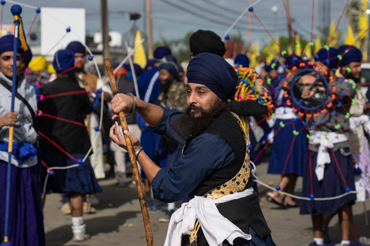 Members of the California Gatka Dal perform martial arts of Punjab during the 2023 Yuba City Nagar Kirtan Sikh parade.