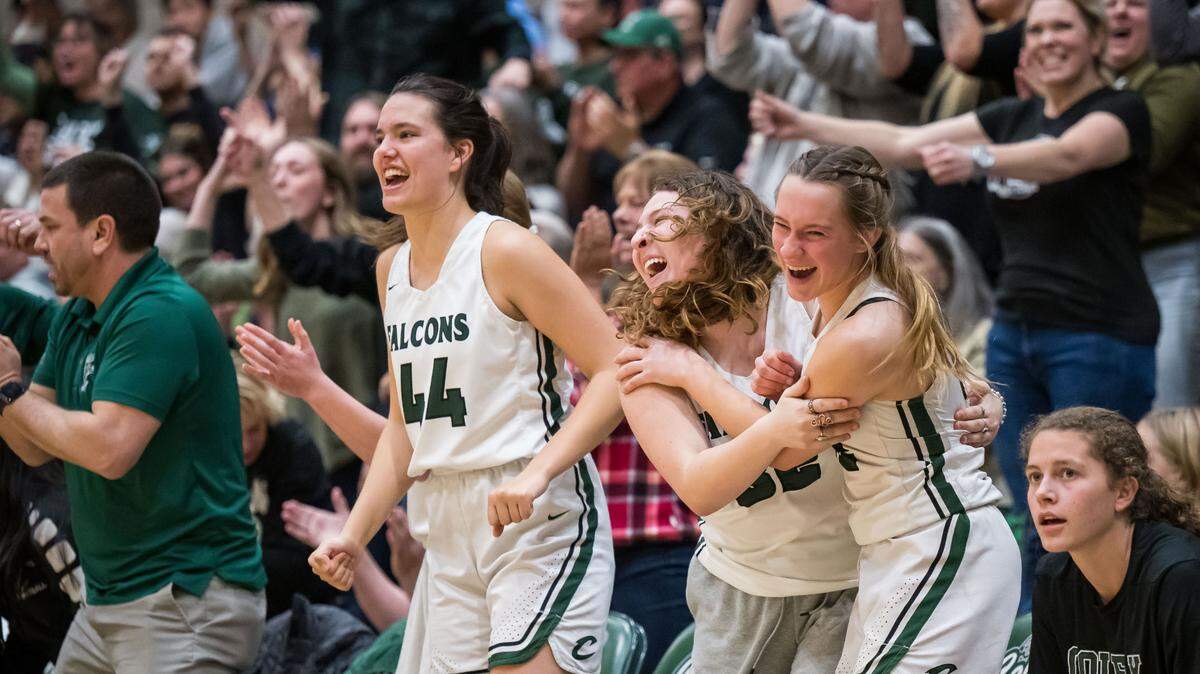 The Colfax Falcons sideline erupts after a three point basket by Colfax Falcons guard Jade Biittner (2) during the fourth quarter against the Caruthers (Fresno County) Blue Raiders at the CIF Northern California Division III high school girls basketball championship game Tuesday, March 7, 2023, at Colfax High School. Colfax beat Caruthers, 53-52, and advances to the state championship game Friday at Golden 1 Center.