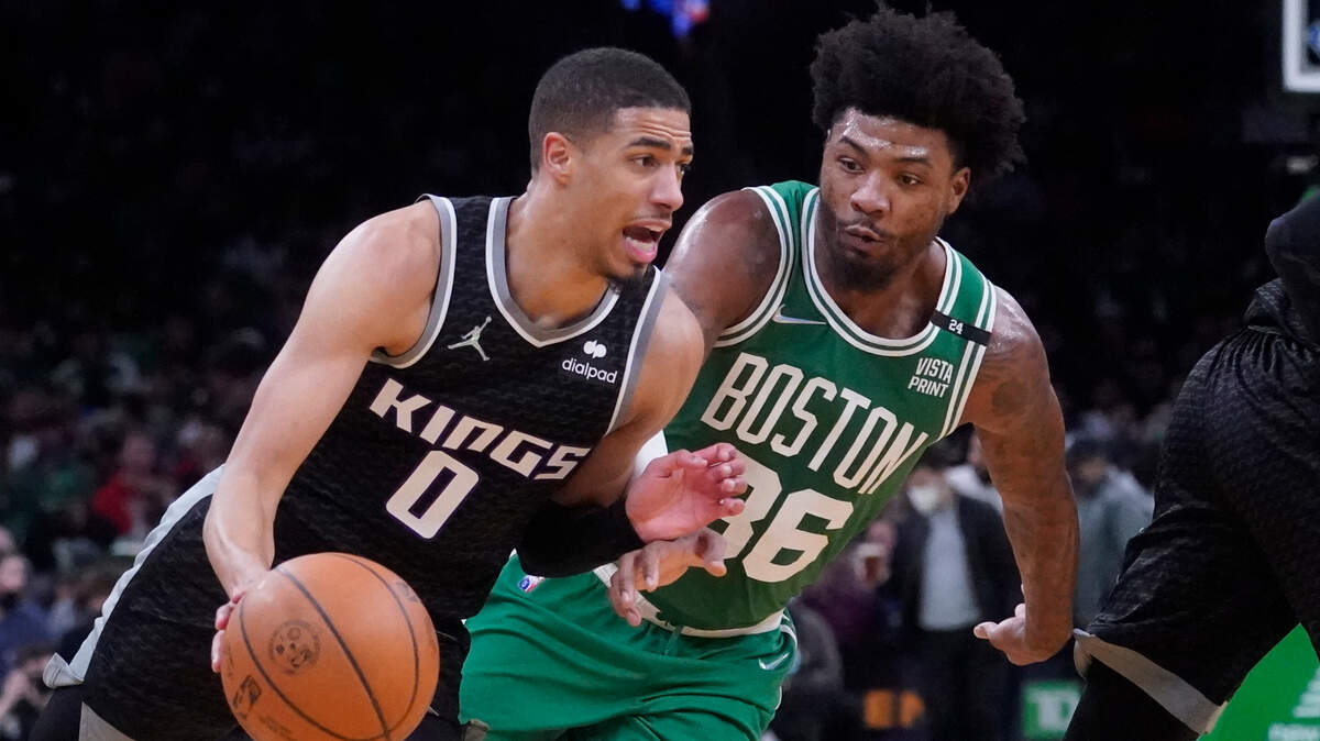 Sacramento Kings guard Tyrese Haliburton (0) tries to outrun Boston Celtics guard Marcus Smart (36) during the second half of an NBA basketball game, Tuesday, Jan. 25, 2022, in Boston. (AP Photo/Charles Krupa)