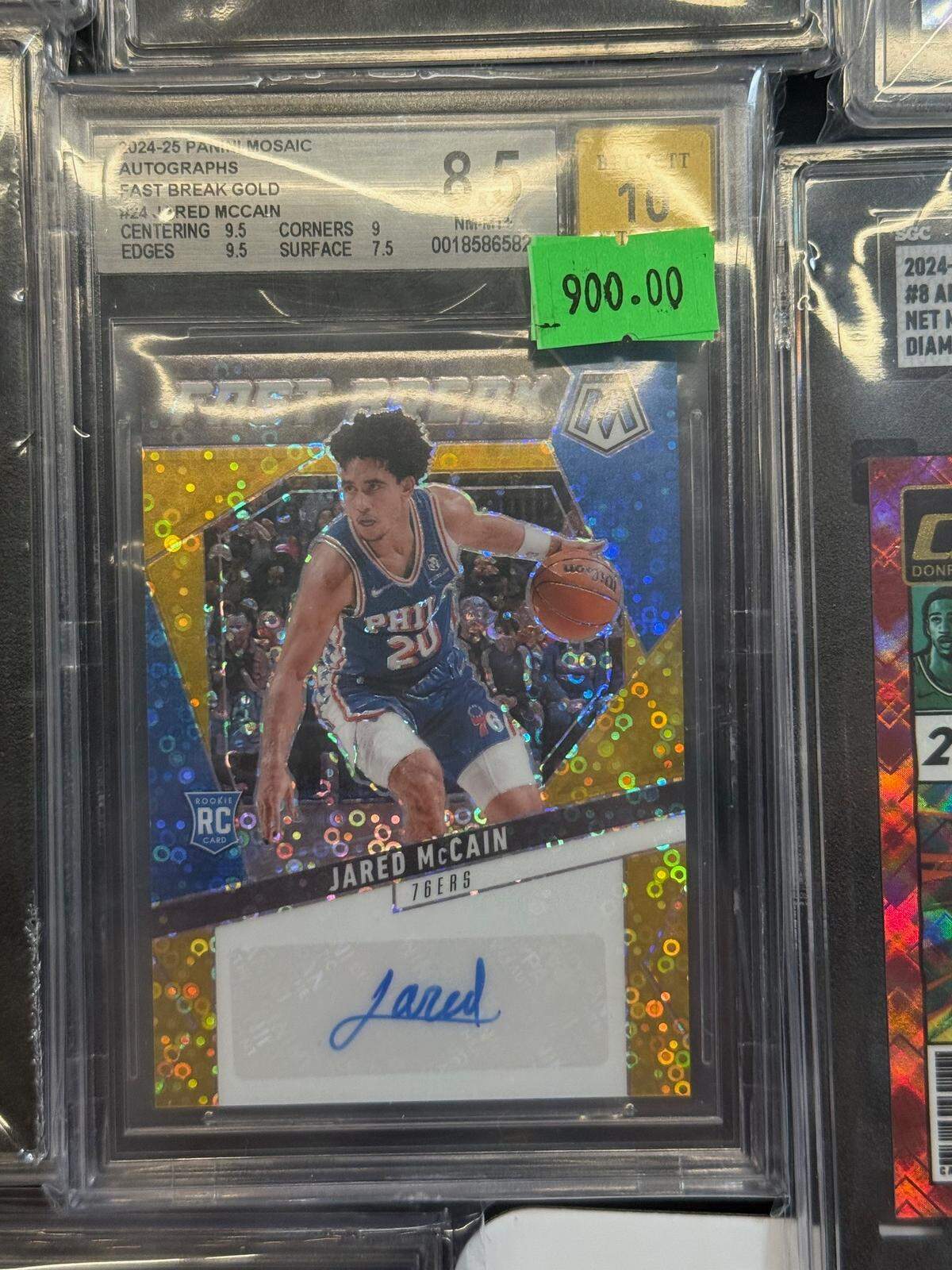 An autographed Jared McCain 2024 Panini Mosiac rookie card is displayed for sale for $900 at the annual Sacramento Autograph and Sports Card Expo at the Grounds in Roseville in September. McCain, who grew up in Sacramento, plays for the Philadelphia 76ers.