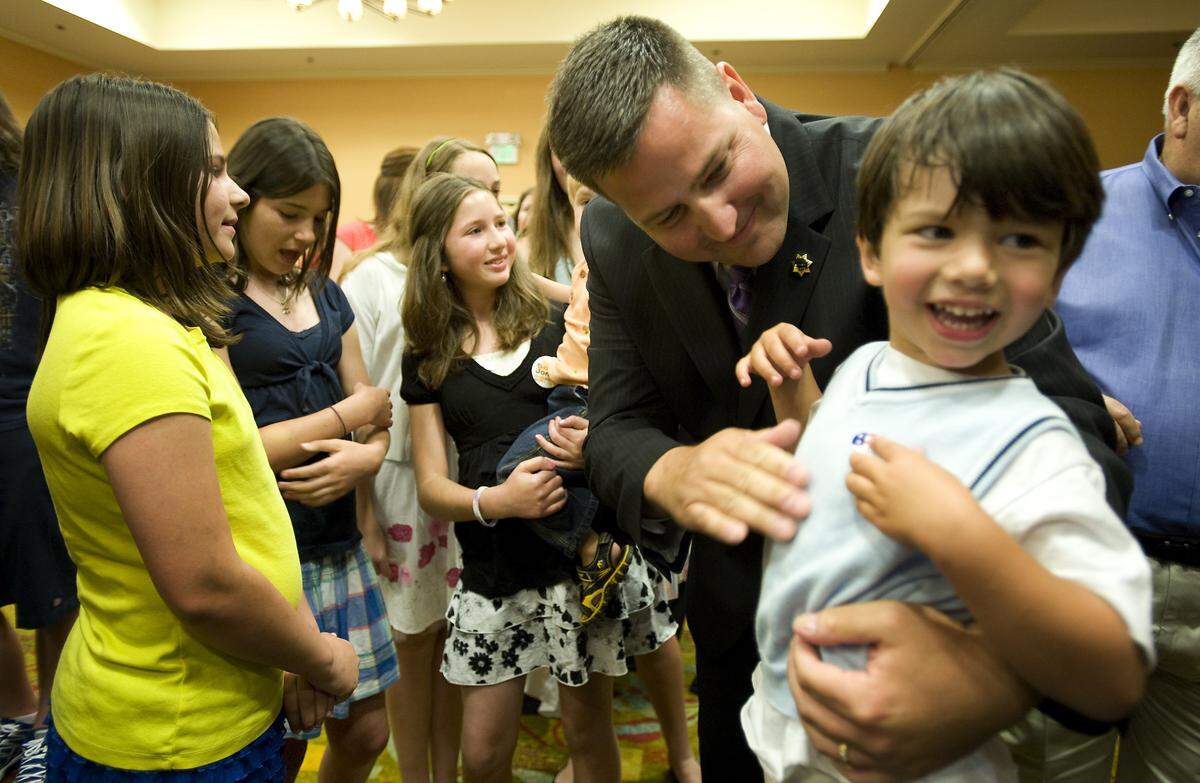 Scott Jones puts an “I voted” sticker on his son Andrew, 3, during the election night party in 2010 for his campaign for Sacramento County Sheriff.