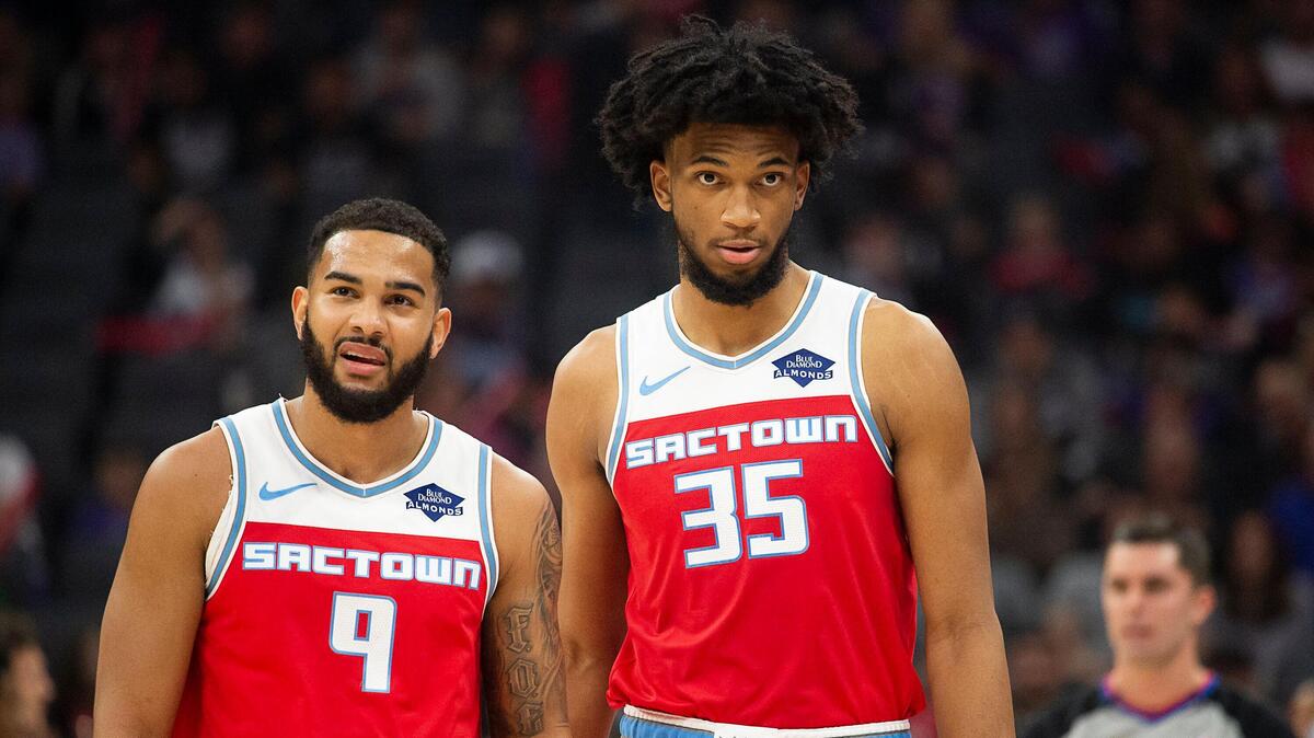 Sacramento Kings guard Cory Joseph (9) and Sacramento Kings forward Marvin Bagley III (35) walk to the bench during a timeout during a game at Golden 1 Center on Wednesday, December 11, 2019 in Sacramento.