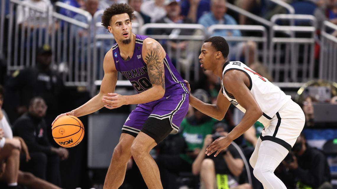 Furman Paladins forward Jalen Slawson (20) is defended by San Diego State Aztecs guard Micah Parrish (3) during the first half in the second round of the 2023 NCAA Tournament at Legacy Arena.