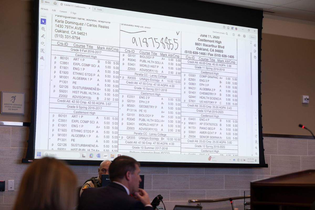 A high school transcript of Carlos Reales Dominguez, the former UC Davis student accused of a stabbing spree in Davis, is displayed as he takes the stand in his defense Monday in Woodland.