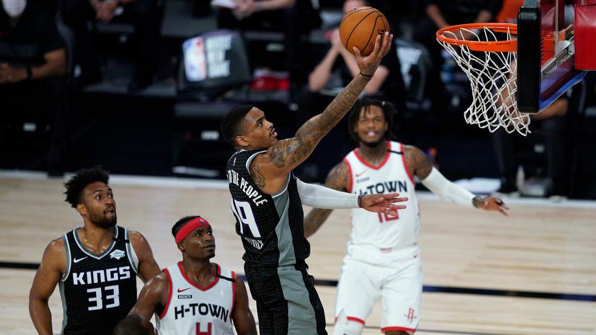 Sacramento Kings’ DaQuan Jeffries (19) puts up a shot above Houston Rockets’ Danuel House Jr. (4) during the second half of an NBA basketball game Sunday, Aug. 9, 2020, in Lake Buena Vista, Fla. (AP Photo/Ashley Landis, Pool)