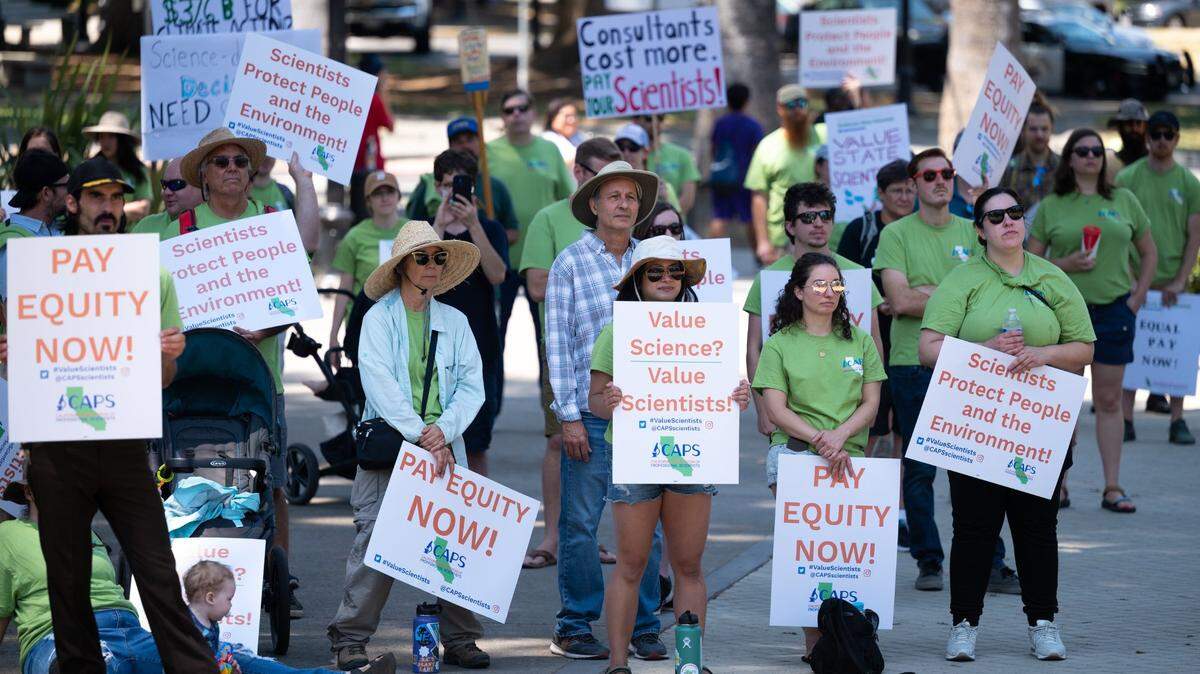 Members of the California Association of Professional Scientists, a union representing 3,800 workers in more than 30 departments of California government, hold a rally on the steps of the state Capitol in Sacramento on Friday, July 29, 2022. The scientists haven’t had a contract for two years and are negotiating for pay raises.